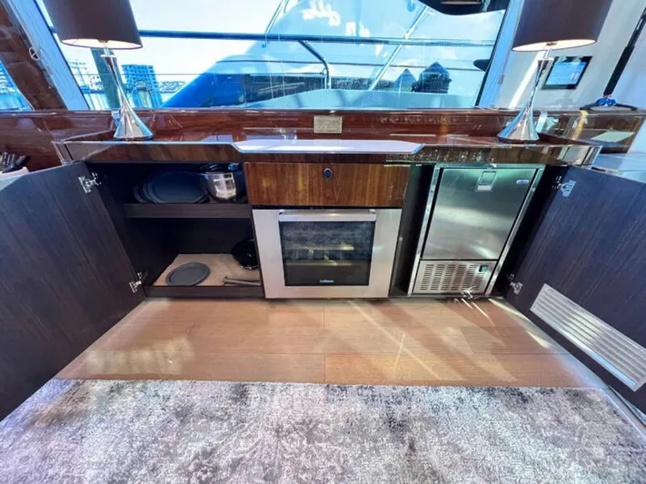 Blind Date Yacht Photos Pics Luxurious kitchen area on a 2020 Fairline Squadron 68 yacht with modern appliances.