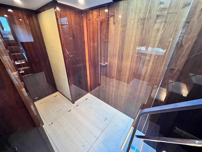 Blind Date Yacht Photos Pics Luxurious interior of 2020 Fairline Squadron 68 yacht with elegant wood paneling.