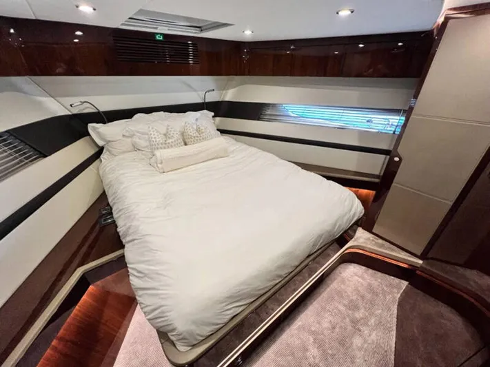 Blind Date Yacht Photos Pics Luxurious bedroom interior of 2020 Fairline Squadron 68 yacht with elegant bedding and modern design.