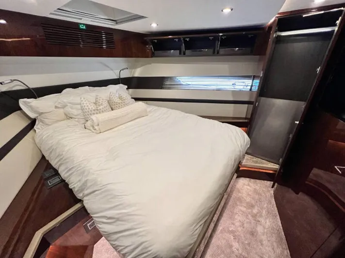 Blind Date Yacht Photos Pics Luxurious bedroom interior of 2020 Fairline Squadron 68 yacht with elegant bedding.