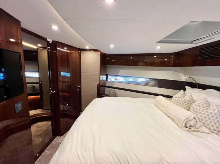 Blind Date Yacht Photos Pics Luxurious bedroom interior of 2020 Fairline Squadron 68 yacht with modern design.