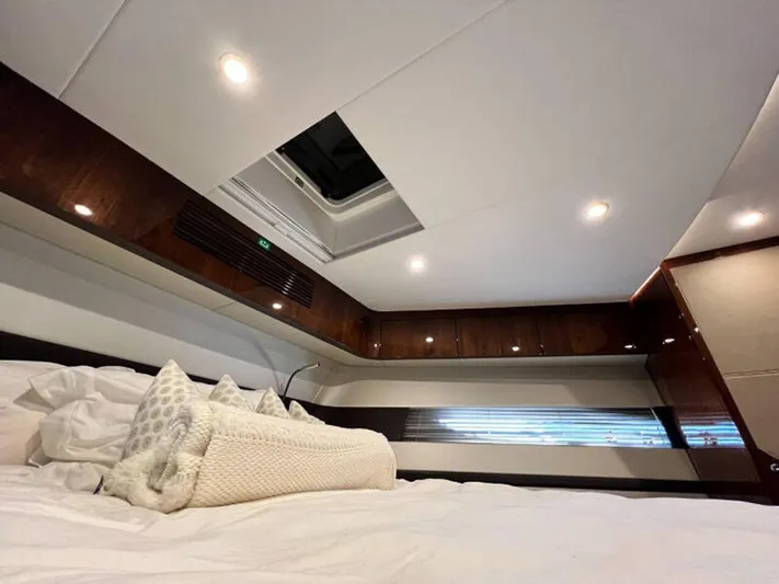 Blind Date Yacht Photos Pics Luxurious cabin interior of 2020 Fairline Squadron 68 yacht with elegant bedding.