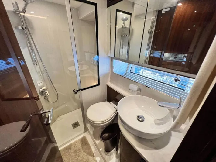 Blind Date Yacht Photos Pics Luxurious bathroom in 2020 Fairline Squadron 68 yacht, featuring modern fixtures and elegant design.