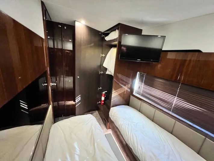 Blind Date Yacht Photos Pics Luxurious cabin interior of 2020 Fairline Squadron 68 yacht with twin beds and TV.
