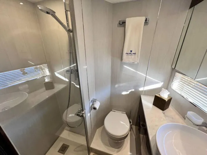 Blind Date Yacht Photos Pics Luxurious bathroom in 2020 Fairline Squadron 68 yacht with modern fixtures and elegant design.