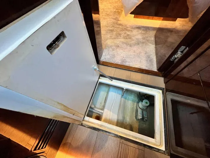 Blind Date Yacht Photos Pics Open hatch on 2020 Fairline Squadron 68 yacht, revealing storage compartment.