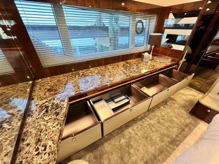 Blind Date Yacht Photos Pics Luxurious interior of 2020 Fairline Squadron 68 yacht with marble countertop and ample storage.