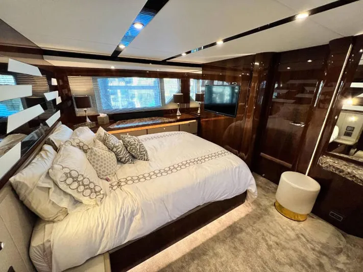 Blind Date Yacht Photos Pics Luxurious bedroom interior of 2020 Fairline Squadron 68 yacht with elegant decor and modern amenities.