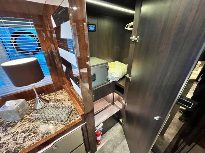 Blind Date Yacht Photos Pics Luxurious interior of 2020 Fairline Squadron 68 yacht with closet and marble-topped dresser.