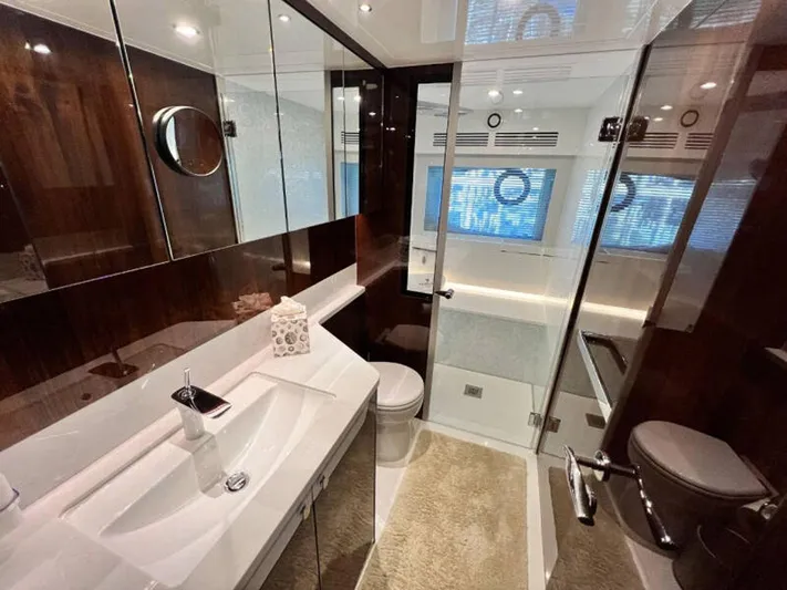 Blind Date Yacht Photos Pics Luxurious bathroom in 2020 Fairline Squadron 68 yacht with modern fixtures and elegant design.