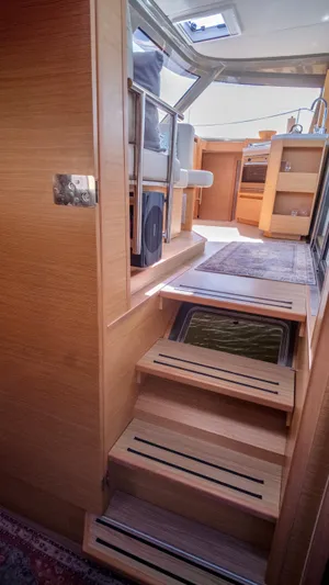 Muse Yacht Photos Pics Interior of 2019 Nautitech 40 Open with wooden stairs.