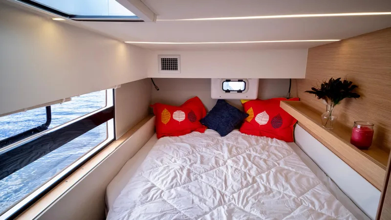Muse Yacht Photos Pics Interior of 2019 Nautitech 40 Open with cozy bed and windows.