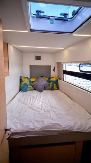 Muse Yacht Photos Pics Interior of Nautitech 40 Open yacht, cozy bedroom with skylight.