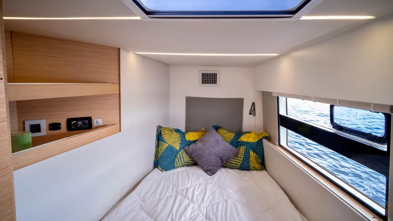 Muse Yacht Photos Pics Interior of 2019 Nautitech 40 Open with bed and window.