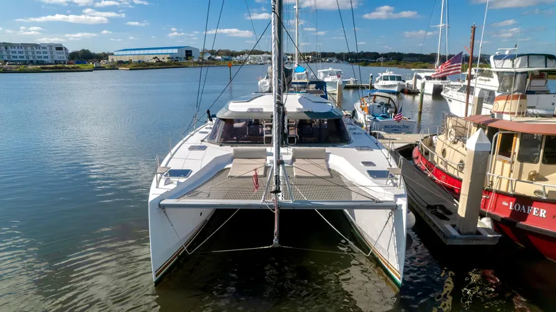 Muse Yacht Photos Pics Nautitech 40 Open 2019 catamaran docked, sunny day.