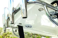 2023 Aquila 28 Molokai boat with stainless steel rod holders and sleek design.