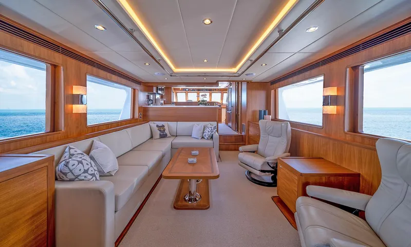 Our Way III Yacht Photos Pics Luxurious interior of 2023 Outer Reef Yachts 720 Motoryacht with elegant seating and ocean views.