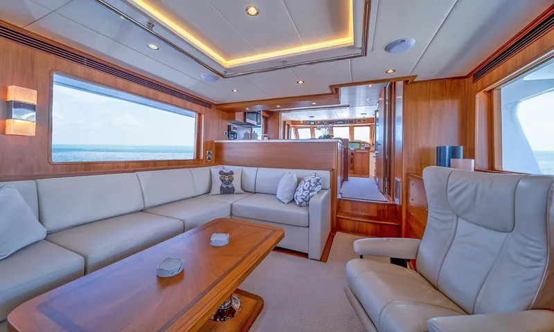 Our Way III Yacht Photos Pics Luxurious interior of 2023 Outer Reef Yachts 720 Motoryacht with elegant seating and wood finishes.