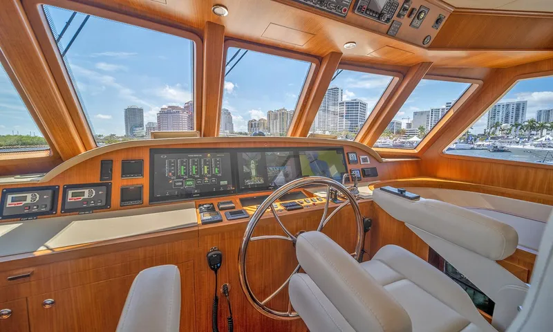 Our Way III Yacht Photos Pics 2023 Outer Reef Yachts 720 Motoryacht helm with modern controls and panoramic windows.