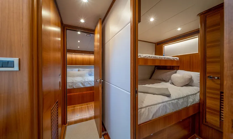 Our Way III Yacht Photos Pics 2023 Outer Reef Yachts 720 Motoryacht interior with cozy wooden cabin and bunk beds.