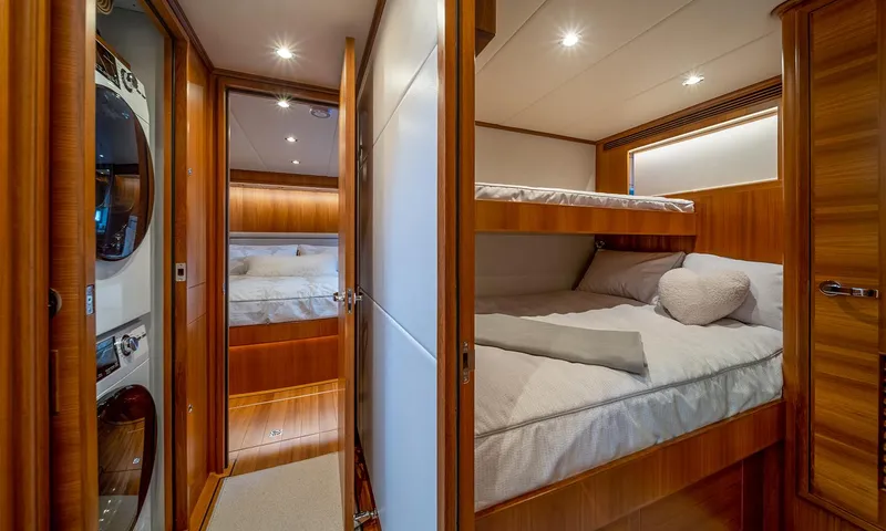 Our Way III Yacht Photos Pics Luxurious cabin interior of 2023 Outer Reef Yachts 720 Motoryacht with cozy bunk beds.
