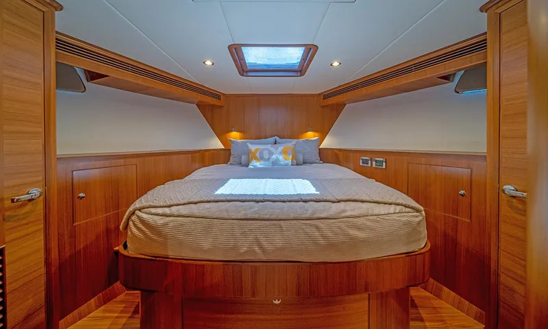 Our Way III Yacht Photos Pics Luxurious cabin interior of 2023 Outer Reef Yachts 720 Motoryacht with wood finish and skylight.