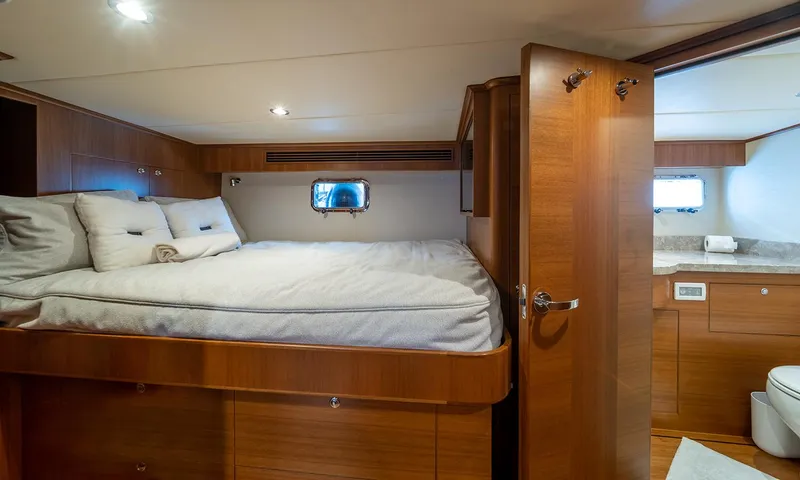 Our Way III Yacht Photos Pics Luxurious cabin interior of 2023 Outer Reef Yachts 720 Motoryacht with ensuite bathroom.