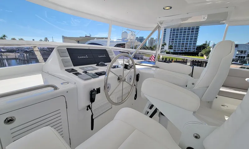 Our Way III Yacht Photos Pics 2023 Outer Reef Yachts 720 Motoryacht helm with modern controls and white seating.