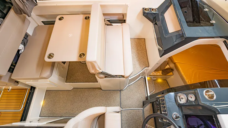  Yacht Photos Pics Interior of 2024 Skamander 920 Explorer MAX boat with seating and control panel.