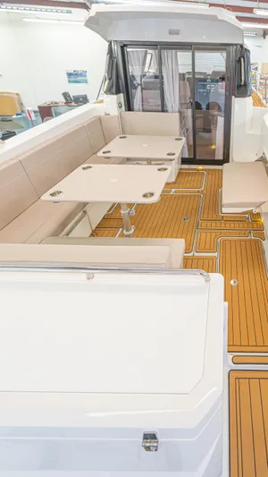  Yacht Photos Pics 2024 Skamander 920 Explorer MAX boat interior with seating and wooden flooring.