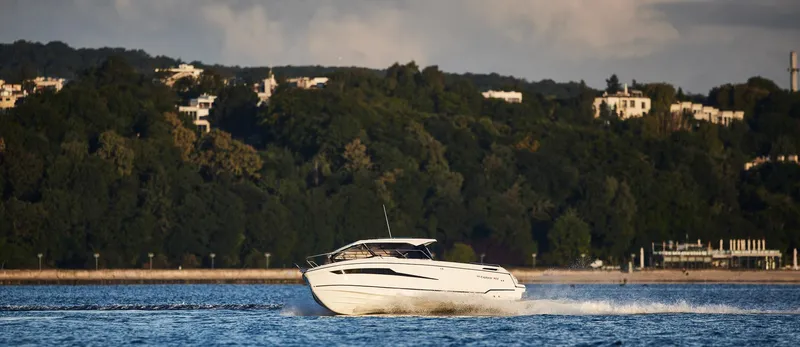  Yacht Photos Pics 2024 Skamander 920 Explorer MAX cruising on a scenic lake.