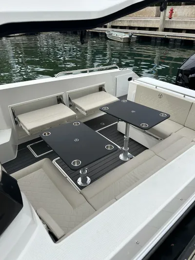  Yacht Photos Pics 2024 Skamander 920 Explorer MAX boat interior with seating and tables.
