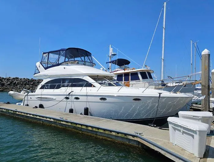  Yacht Photos Pics 2007 Meridian 411 Sedan yacht docked at marina under clear blue sky.