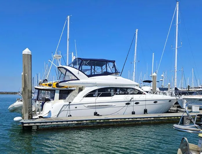  Yacht Photos Pics 2007 Meridian 411 Sedan yacht docked at marina under clear blue sky.