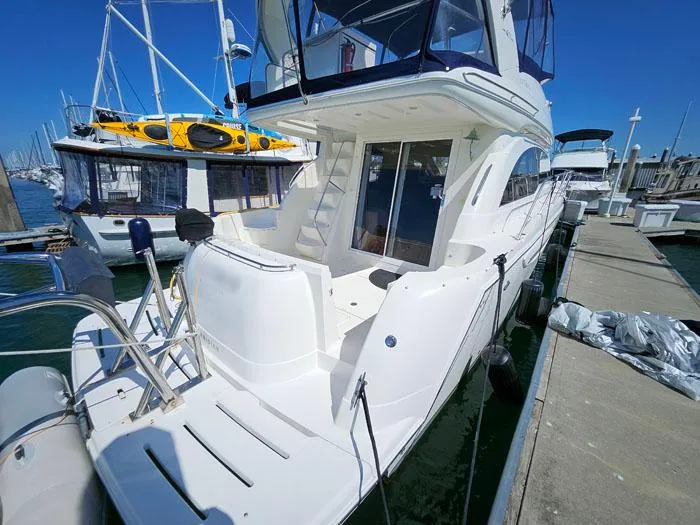  Yacht Photos Pics 2007 Meridian 411 Sedan yacht docked at marina under clear blue sky.