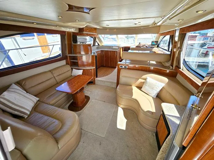  Yacht Photos Pics Luxurious interior of a 2007 Meridian 411 Sedan yacht with plush seating and elegant wood finishes.
