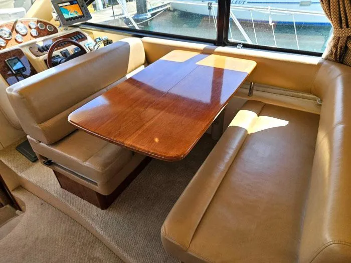  Yacht Photos Pics Interior of 2007 Meridian 411 Sedan yacht with leather seating and wooden table.
