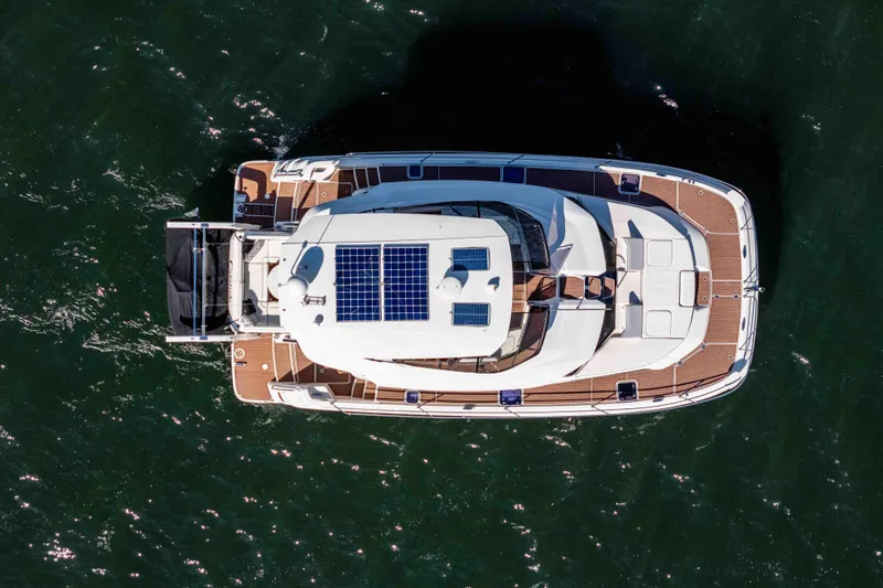 Catatude Yacht Photos Pics Aerial view of 2016 Aquila 44 Power Catamaran with solar panels on deck.