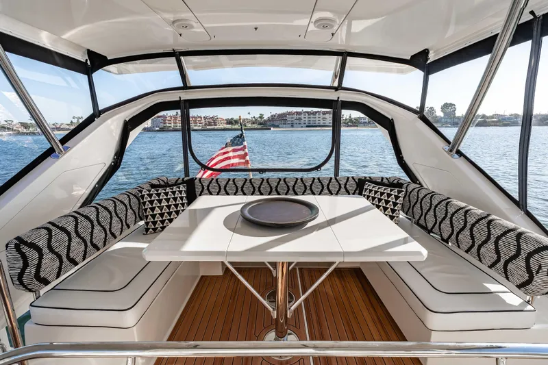 Catatude Yacht Photos Pics Luxurious interior of 2016 Aquila 44 Power Cat with stylish seating and scenic water view.