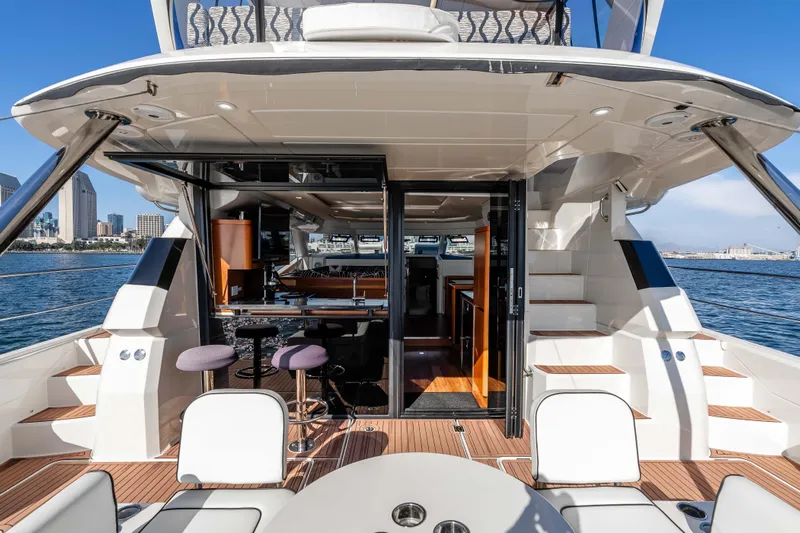 Catatude Yacht Photos Pics Aquila 44 Power Cat 2016 yacht interior with open deck, bar stools, and ocean view.