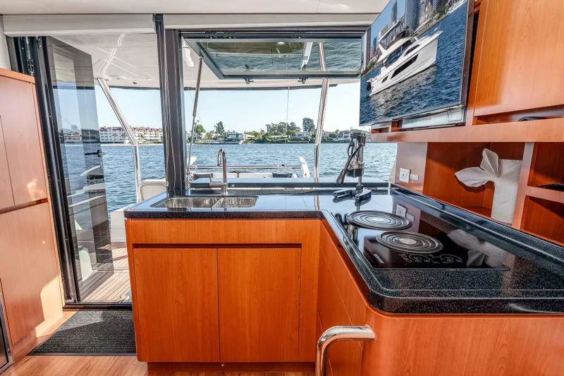 Catatude Yacht Photos Pics Modern kitchen interior on 2016 Aquila 44 Power Cat with waterfront view.