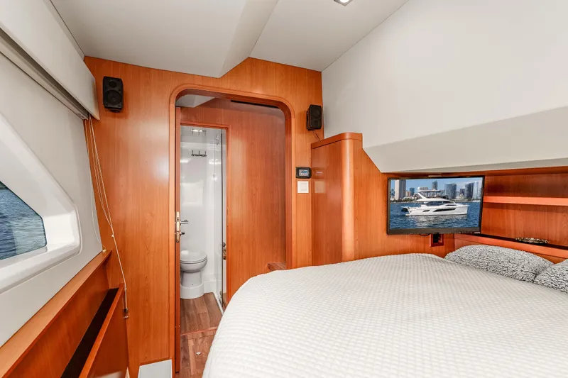 Catatude Yacht Photos Pics Luxurious cabin interior of 2016 Aquila 44 Power Cat with ensuite bathroom and TV.