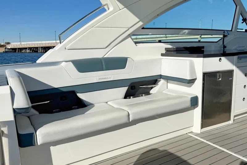  Yacht Photos Pics 2020 Formula 400 Super Sport Crossover boat interior with sleek seating and cabinetry.