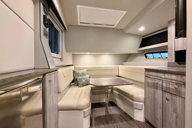  Yacht Photos Pics 2020 Formula 400 Super Sport Crossover interior with modern seating and table.