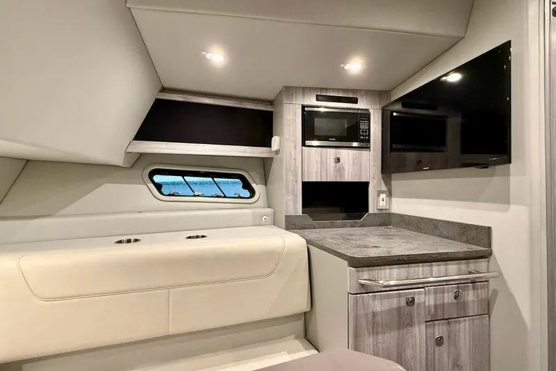  Yacht Photos Pics Interior of 2020 Formula 400 Super Sport Crossover with modern kitchenette and seating.