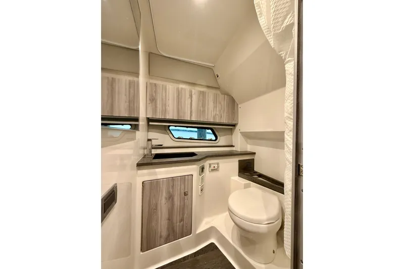  Yacht Photos Pics 2020 Formula 400 Super Sport Crossover bathroom with modern design and wood accents.