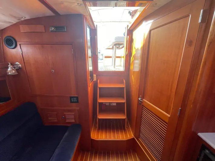  Yacht Photos Pics Interior of 1997 Little Harbor WhisperJet 36, featuring wooden cabinetry and seating.