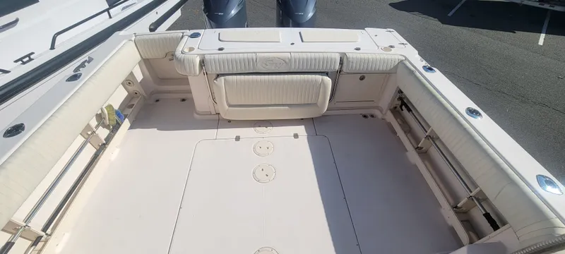 Fishin' Feinz Yacht Photos Pics 2008 Grady-White 330 Express boat deck with seating and storage compartments.