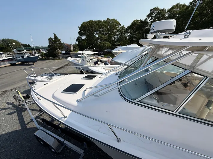 Fishin' Feinz Yacht Photos Pics 2008 Grady-White 330 Express boat docked, showcasing sleek design and spacious deck.