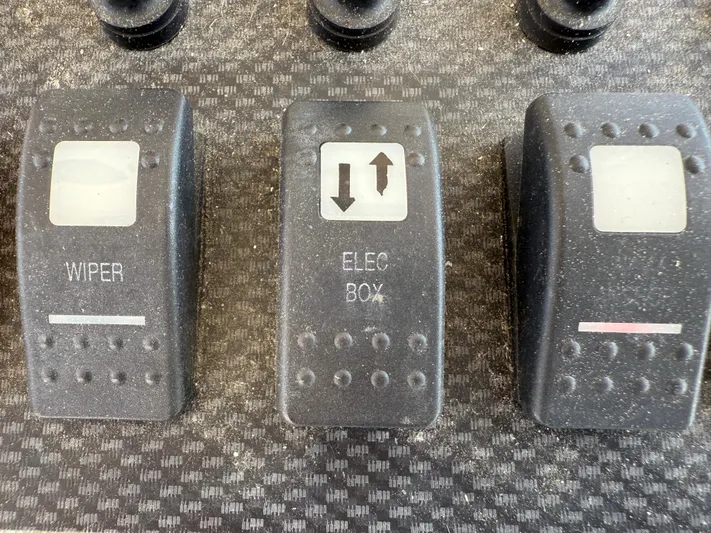 Fishin' Feinz Yacht Photos Pics Control panel switches on a 2008 Grady-White 330 Express boat.